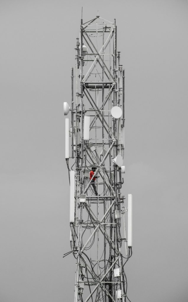 a-tall-tower-with-many-antennas-on-top-of-it-rm0jorrtp0m